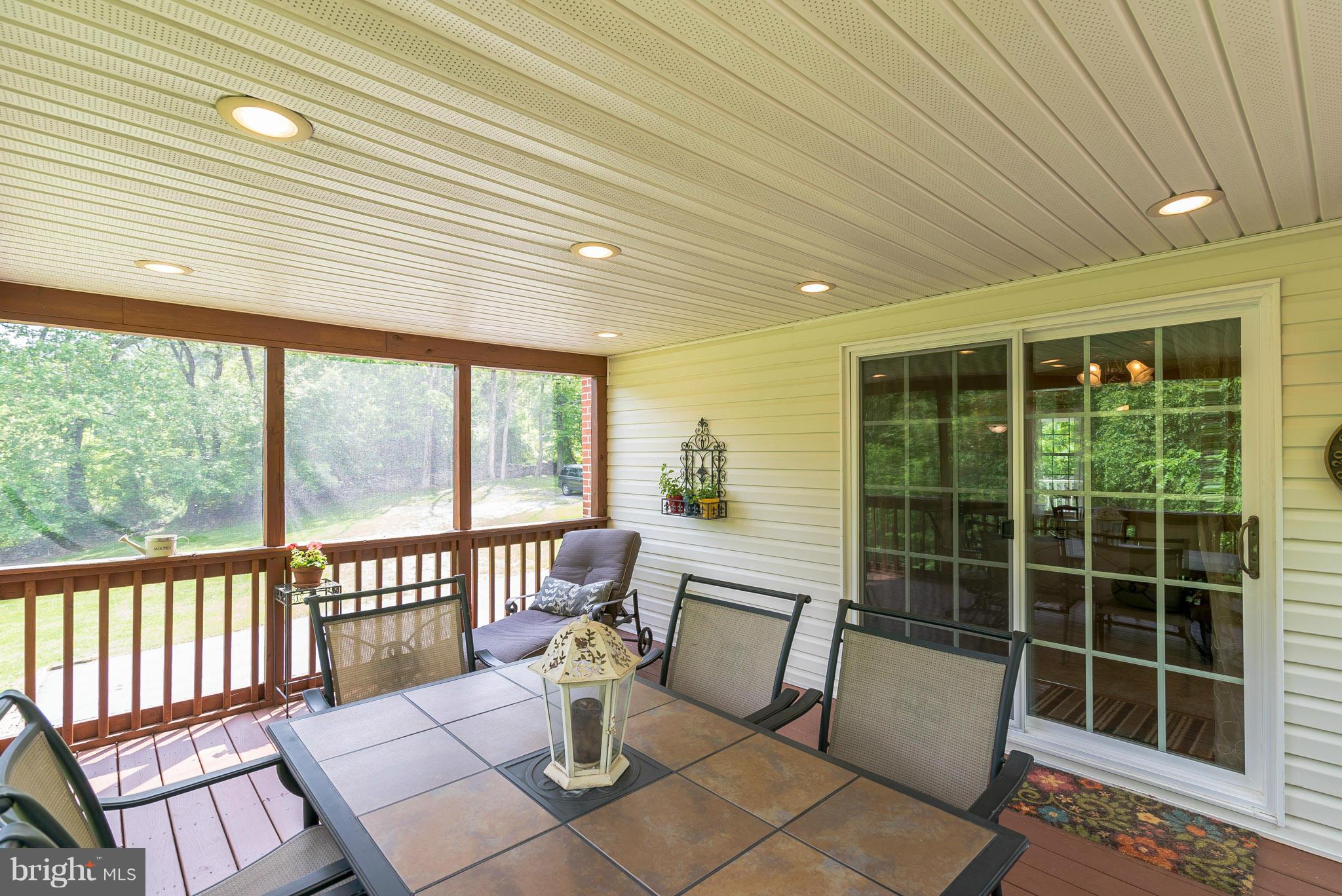 12888 Sagle Road Purcellville, VA 20132 - Photo 7 of 30 Screened porch opens to rear deck as well