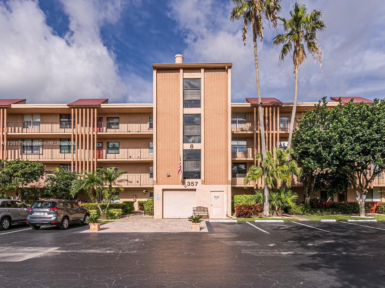 357 North Rock Island Road, Unit 304 Margate, FL 33063 - Photo 1 of 20 front view of a building with a street