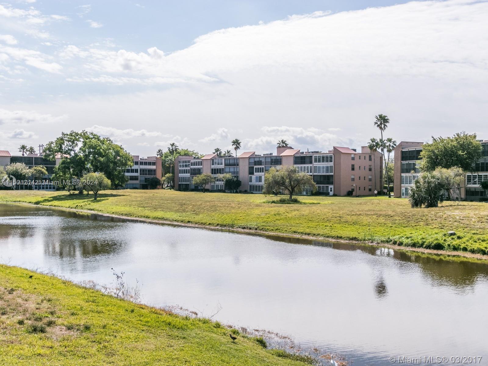 357 North Rock Island Road, Unit 304 Margate, FL 33063 - Photo 14 of 20 a view of a swimming pool and lake