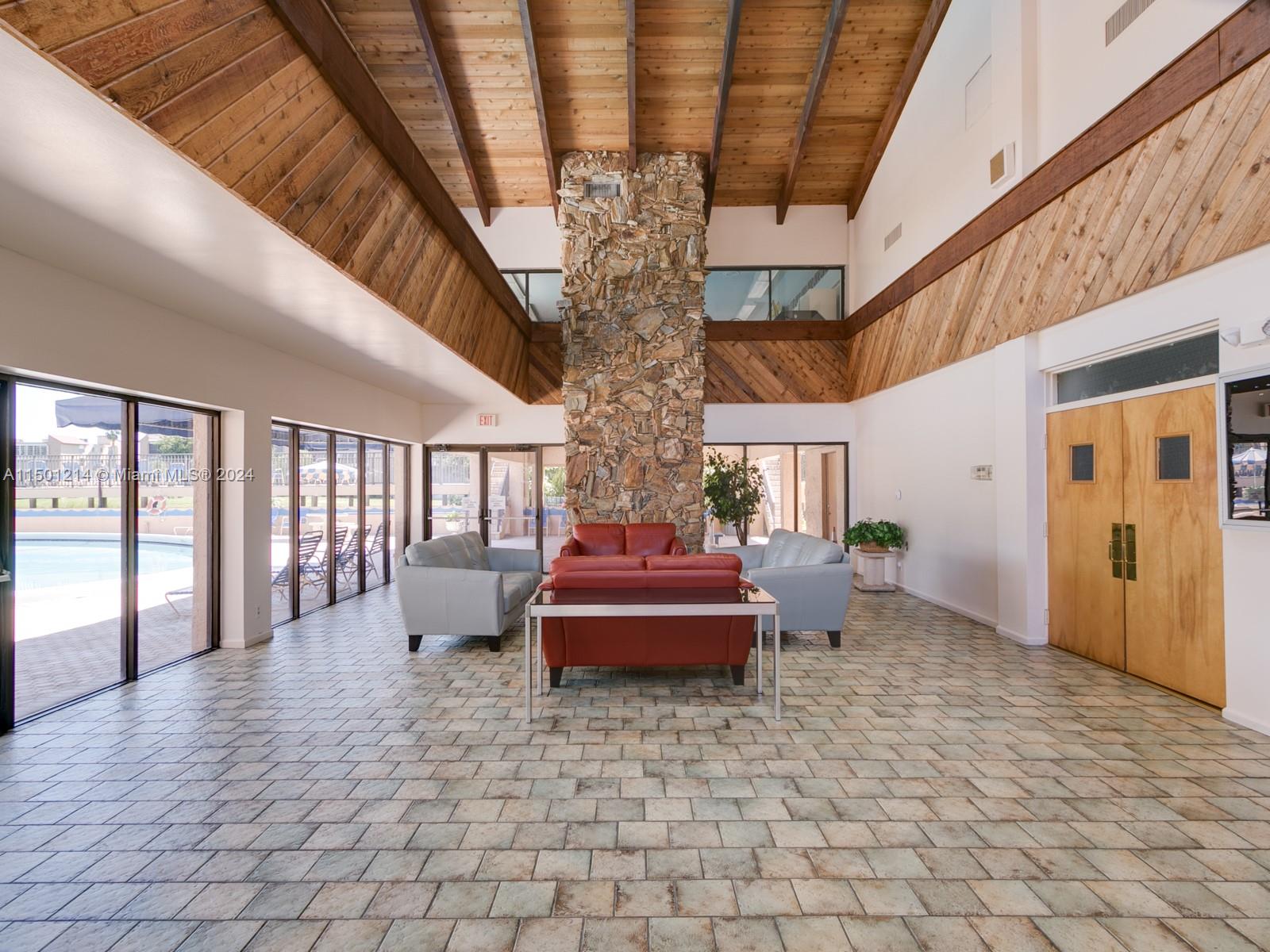 357 North Rock Island Road, Unit 304 Margate, FL 33063 - Photo 6 of 20 a very nice looking room with lots of potted plants