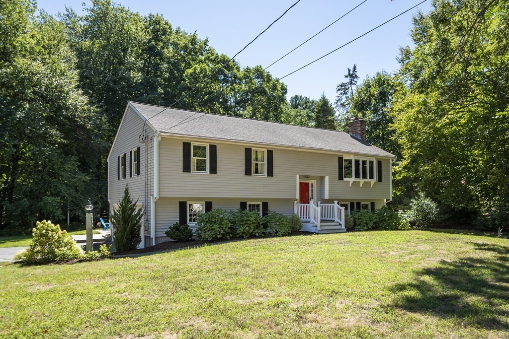 221 Red Acre Road Stow, MA 01775 - Photo 1 of 28 a view of a house with a yard