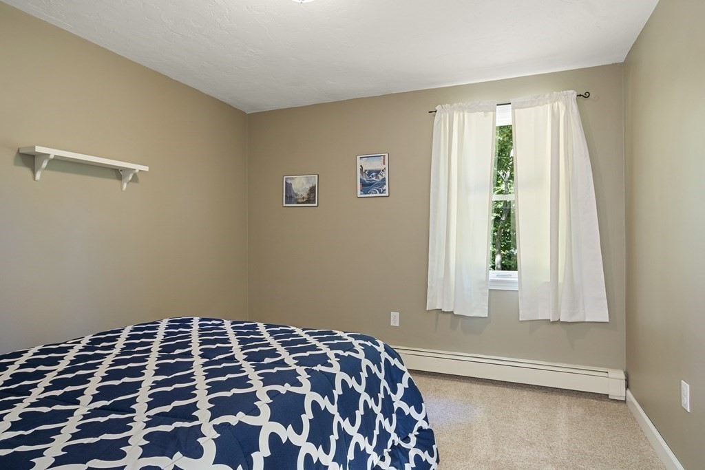 221 Red Acre Road Stow, MA 01775 - Photo 14 of 28 a bedroom with a bed and a window