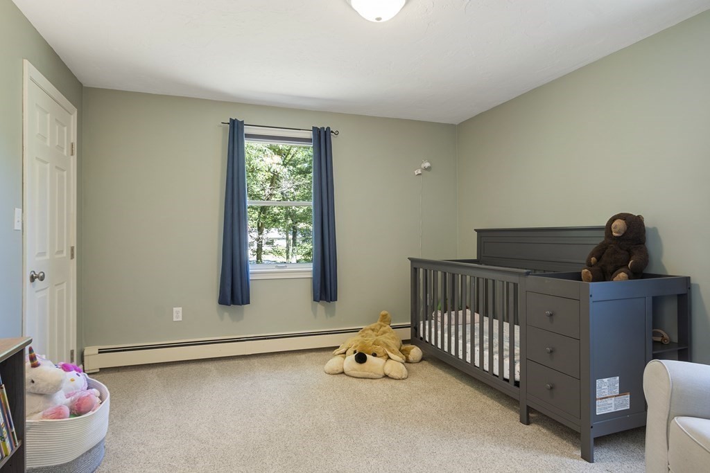 221 Red Acre Road Stow, MA 01775 - Photo 15 of 28 a view of a room with a window and storage