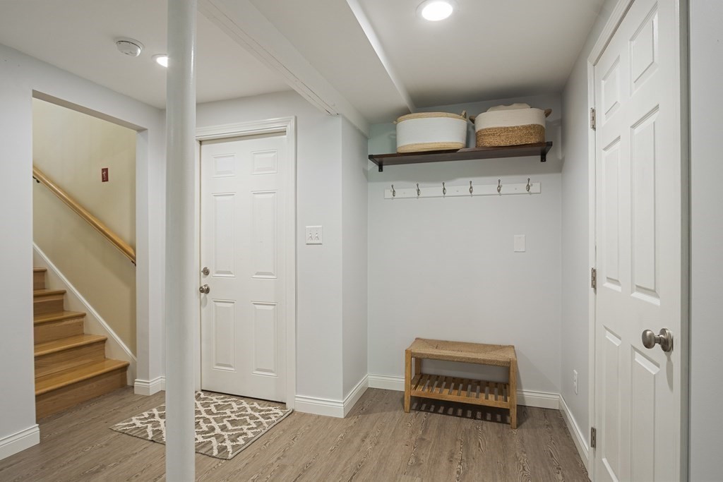 221 Red Acre Road Stow, MA 01775 - Photo 19 of 28 a view of a hallway with entryway wooden floor and front door