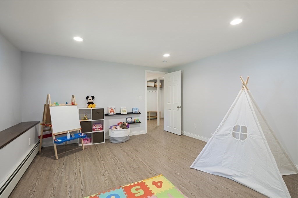 221 Red Acre Road Stow, MA 01775 - Photo 20 of 28 a room with furniture and wooden floor