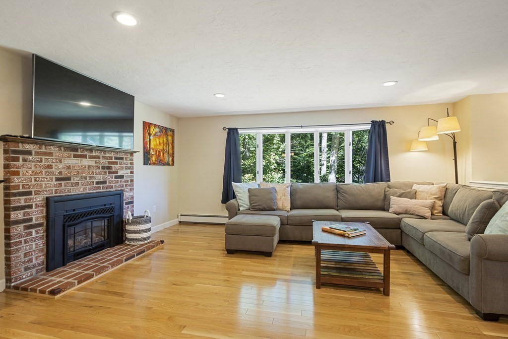221 Red Acre Road Stow, MA 01775 - Photo 4 of 28 a living room with furniture and a fireplace