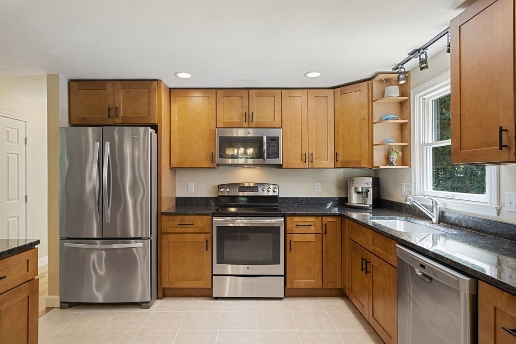 221 Red Acre Road Stow, MA 01775 - Photo 9 of 28 a kitchen with a refrigerator sink and microwave