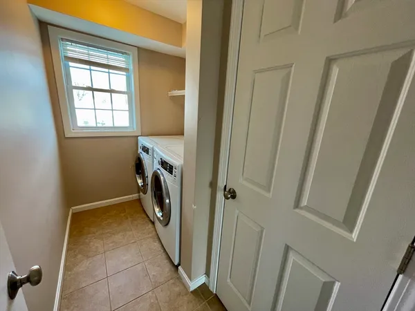 a view of hallway with washer and dryer