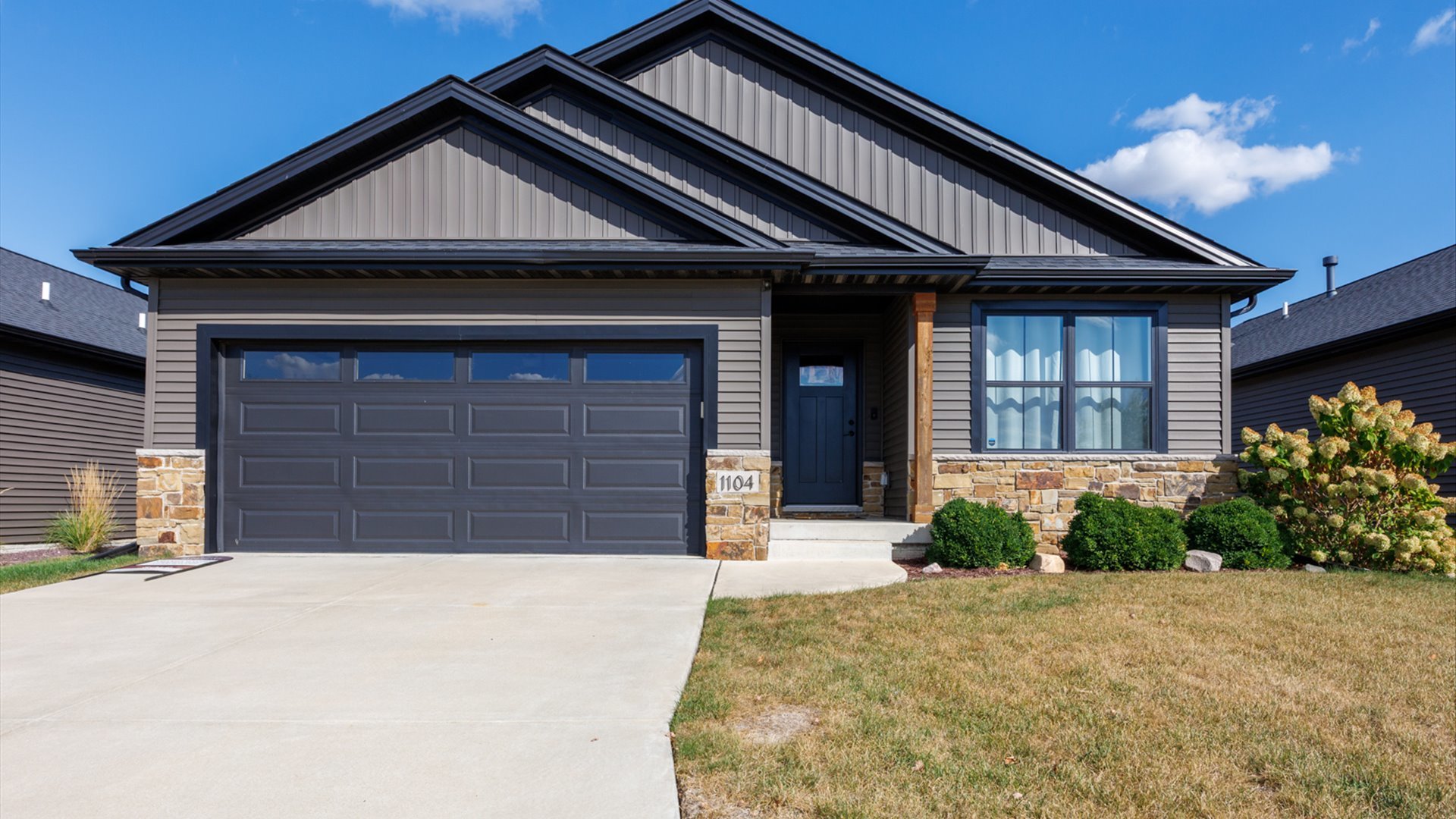 a front view of a house with garden