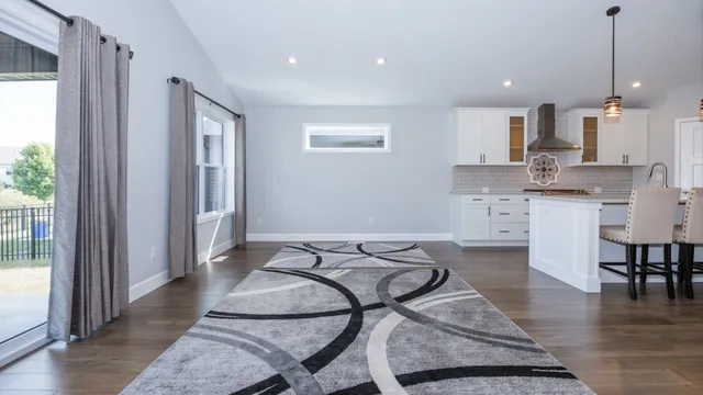 a view of a kitchen and dining room