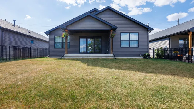 a view of a house with a yard and garage