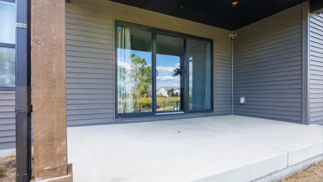 a view of an empty room with large window