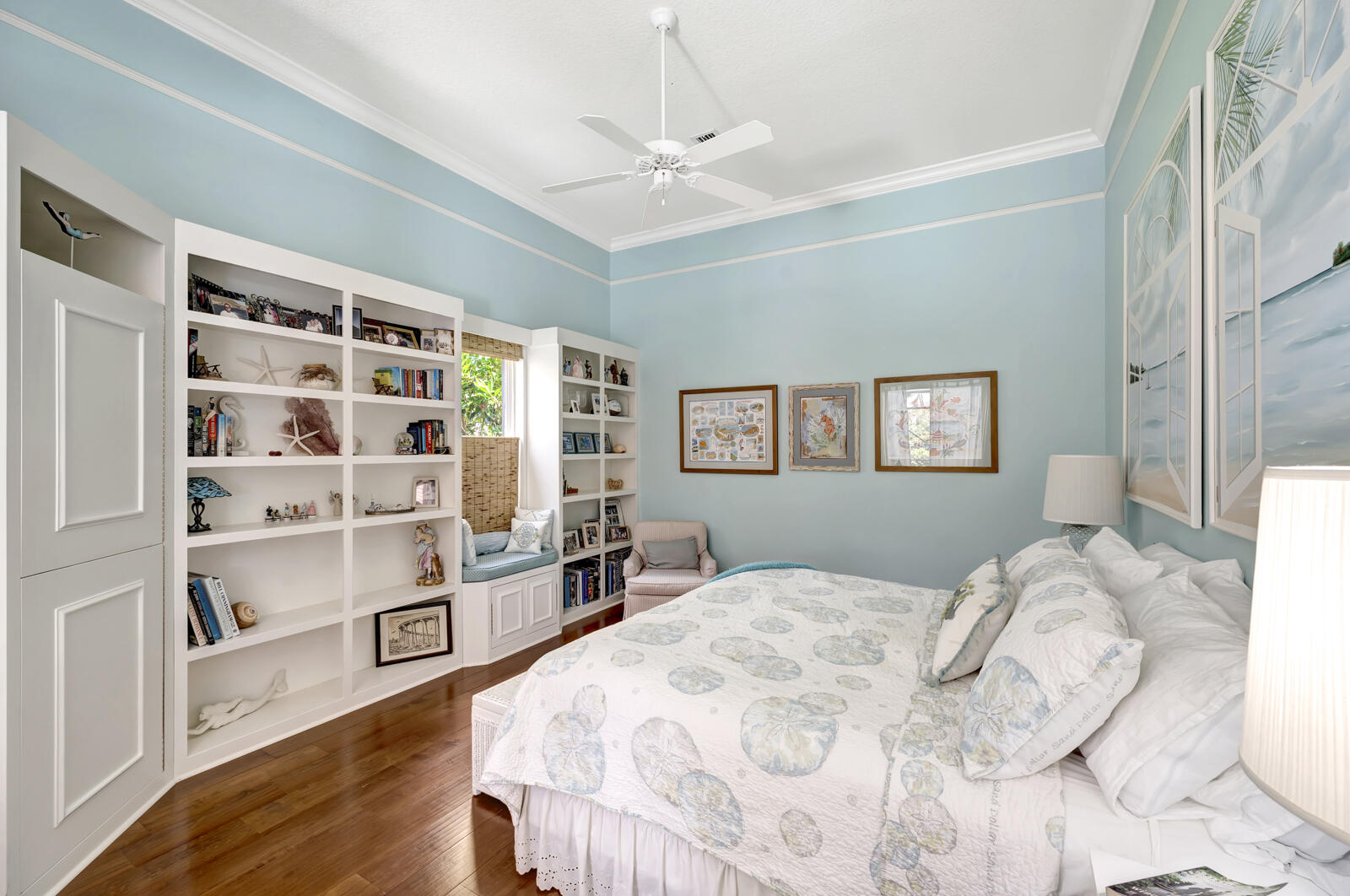 201 Seaside Pathway Vero Beach, FL 32963 - Photo 13 of 53 a bedroom with a bed cabinets and a window