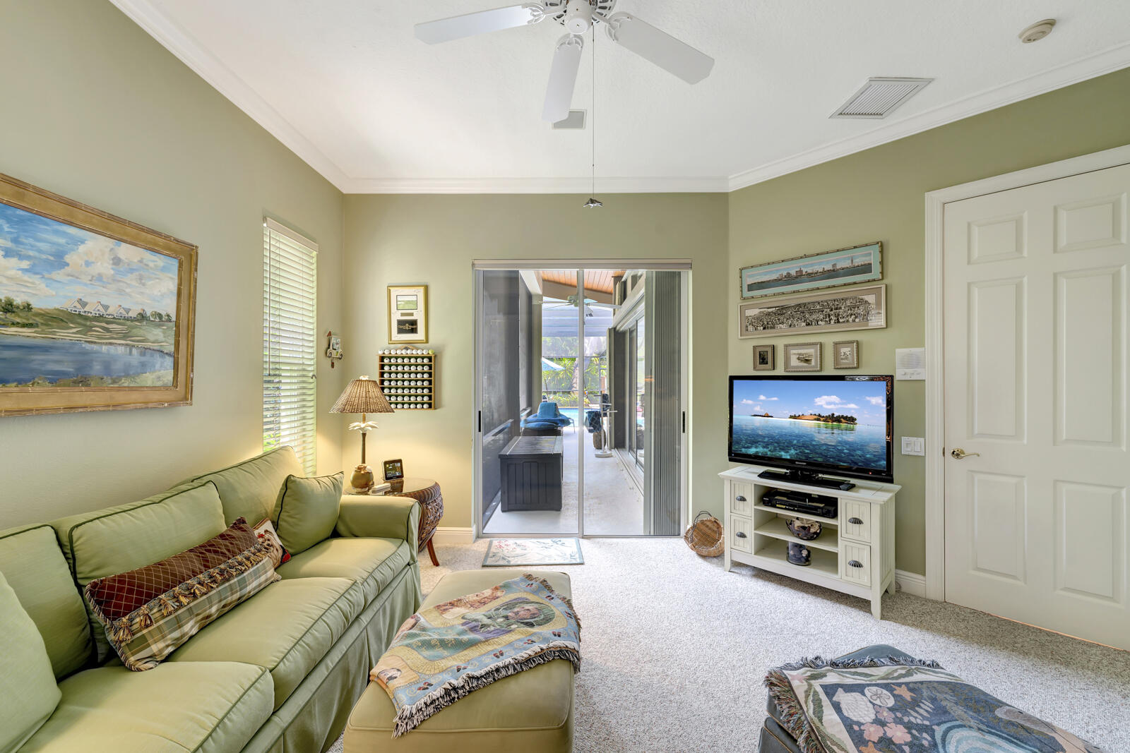 201 Seaside Pathway Vero Beach, FL 32963 - Photo 16 of 53 a living room with furniture and a flat screen tv