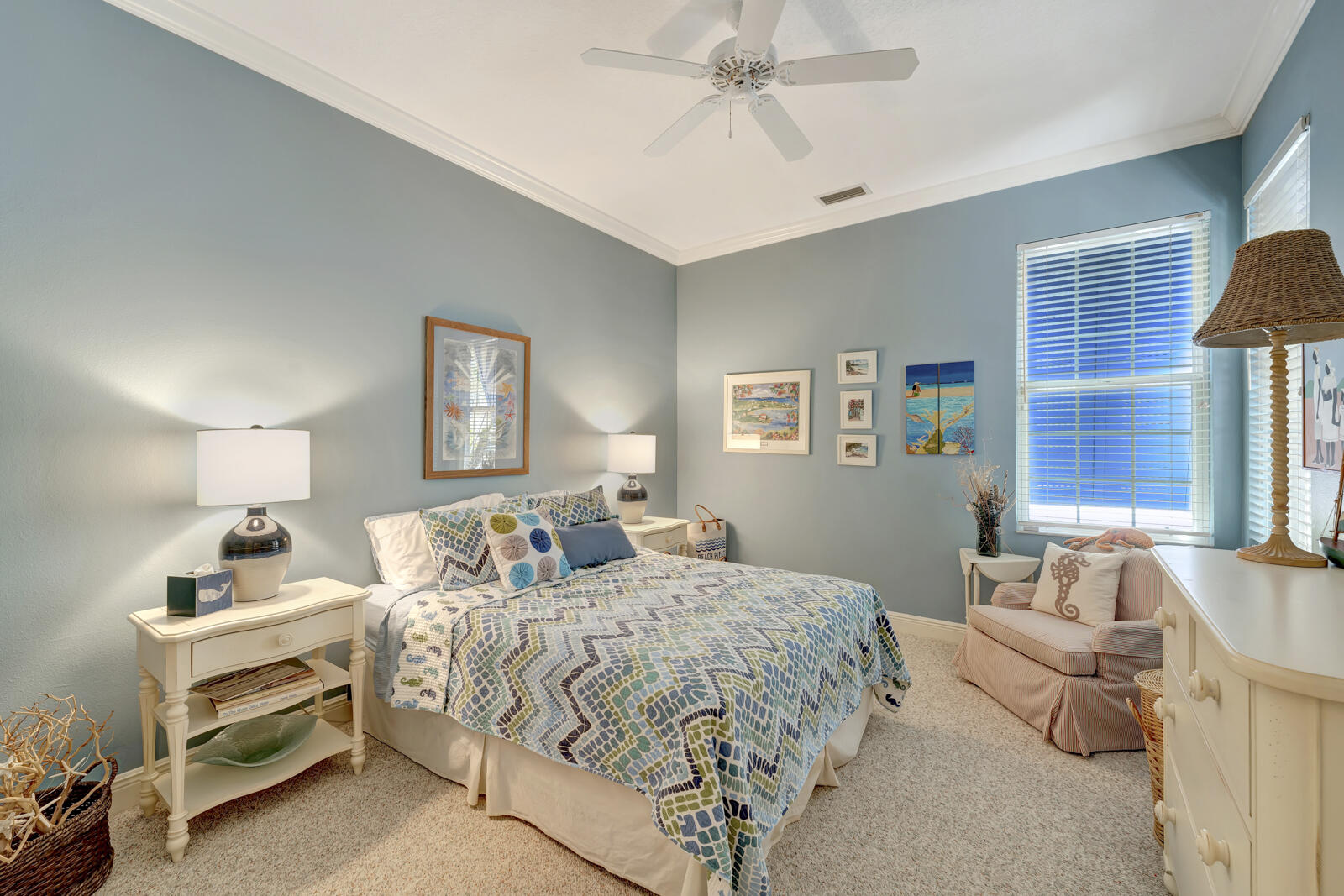 201 Seaside Pathway Vero Beach, FL 32963 - Photo 17 of 53 a bedroom with a bed and a chandelier
