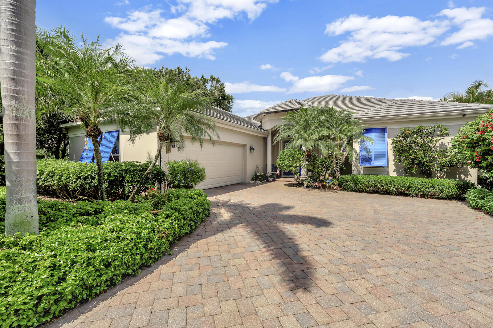 201 Seaside Pathway Vero Beach, FL 32963 - Photo 41 of 53 a front view of a house with a yard and potted plants