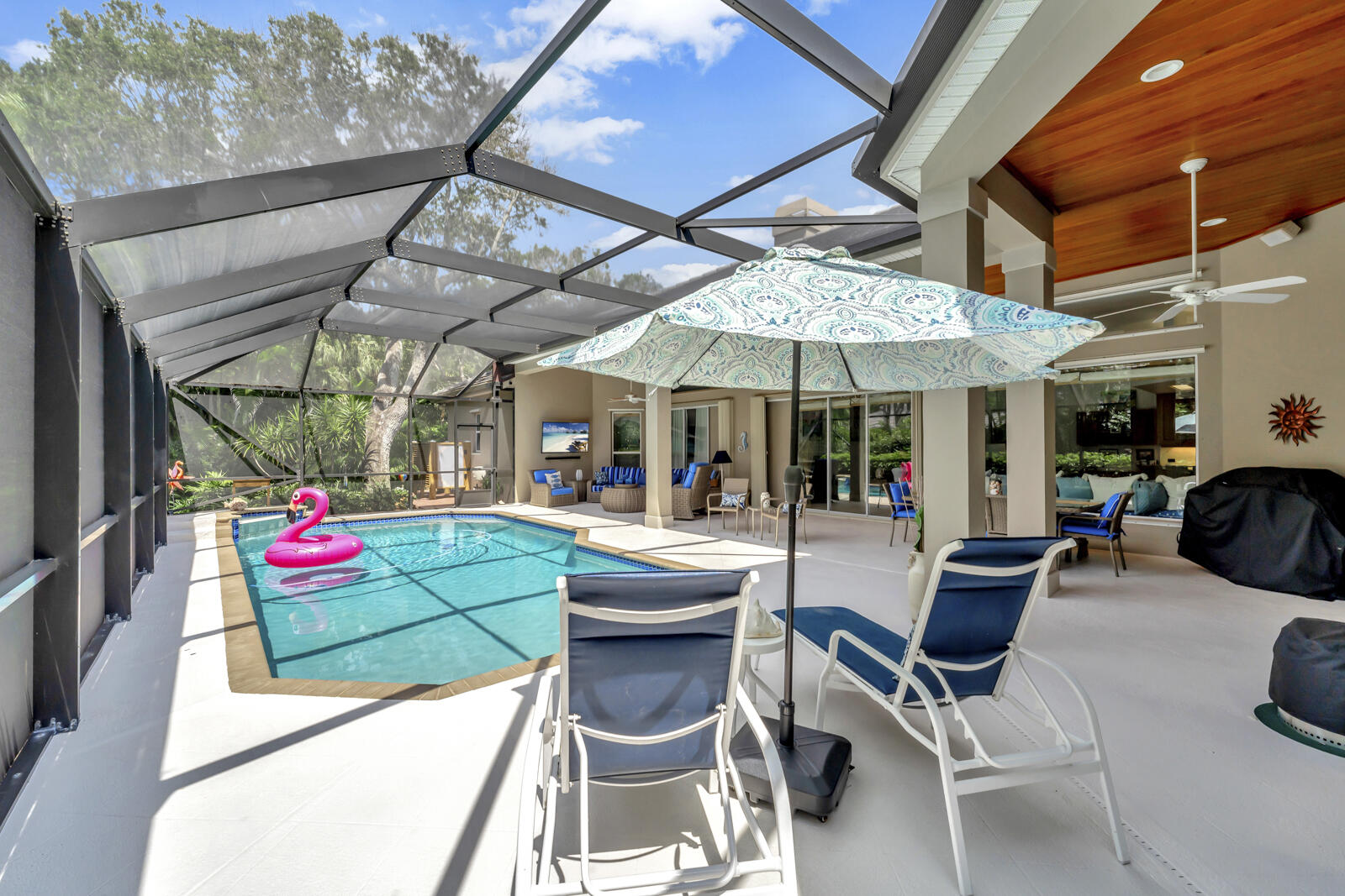 201 Seaside Pathway Vero Beach, FL 32963 - Photo 49 of 53 a view of patio with a table and chairs under an umbrella