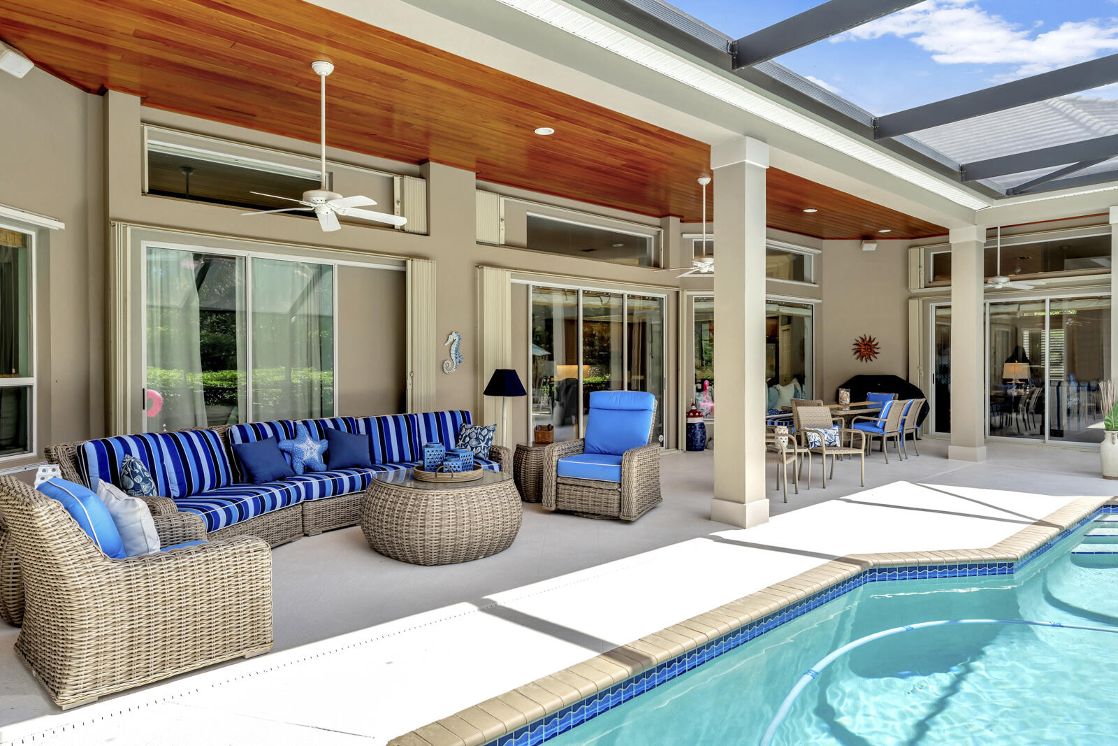 201 Seaside Pathway Vero Beach, FL 32963 - Photo 52 of 53 a view of a patio with couches chairs and potted plants