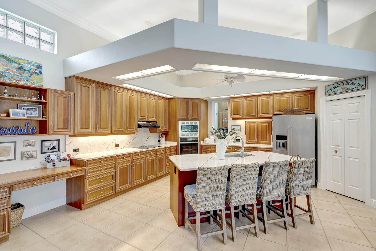 201 Seaside Pathway Vero Beach, FL 32963 - Photo 9 of 53 a large kitchen with a table and chairs