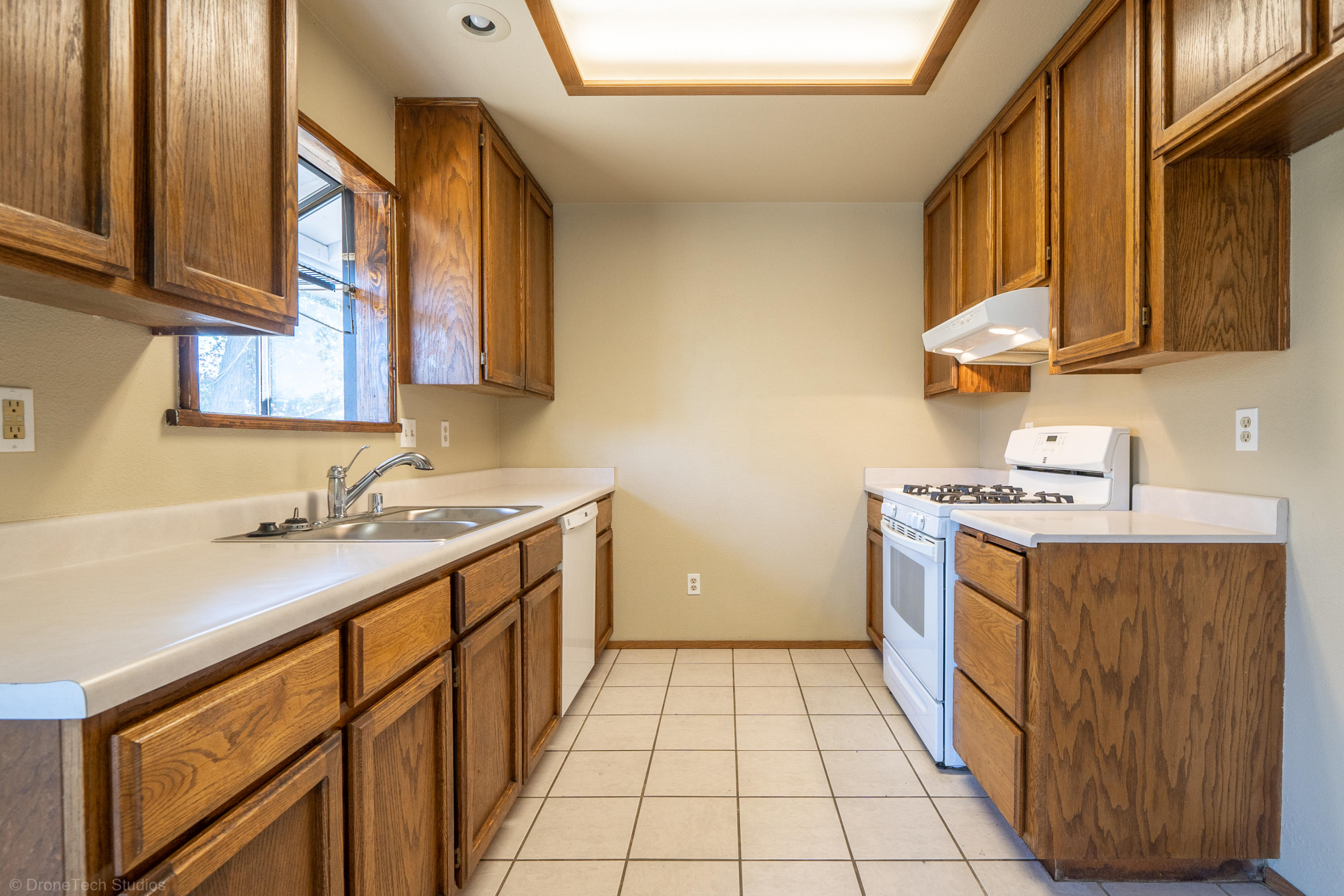 3645 Santa Rosa Way Redding, CA 96003 - Photo 14 of 48 a kitchen with a sink stove and cabinets