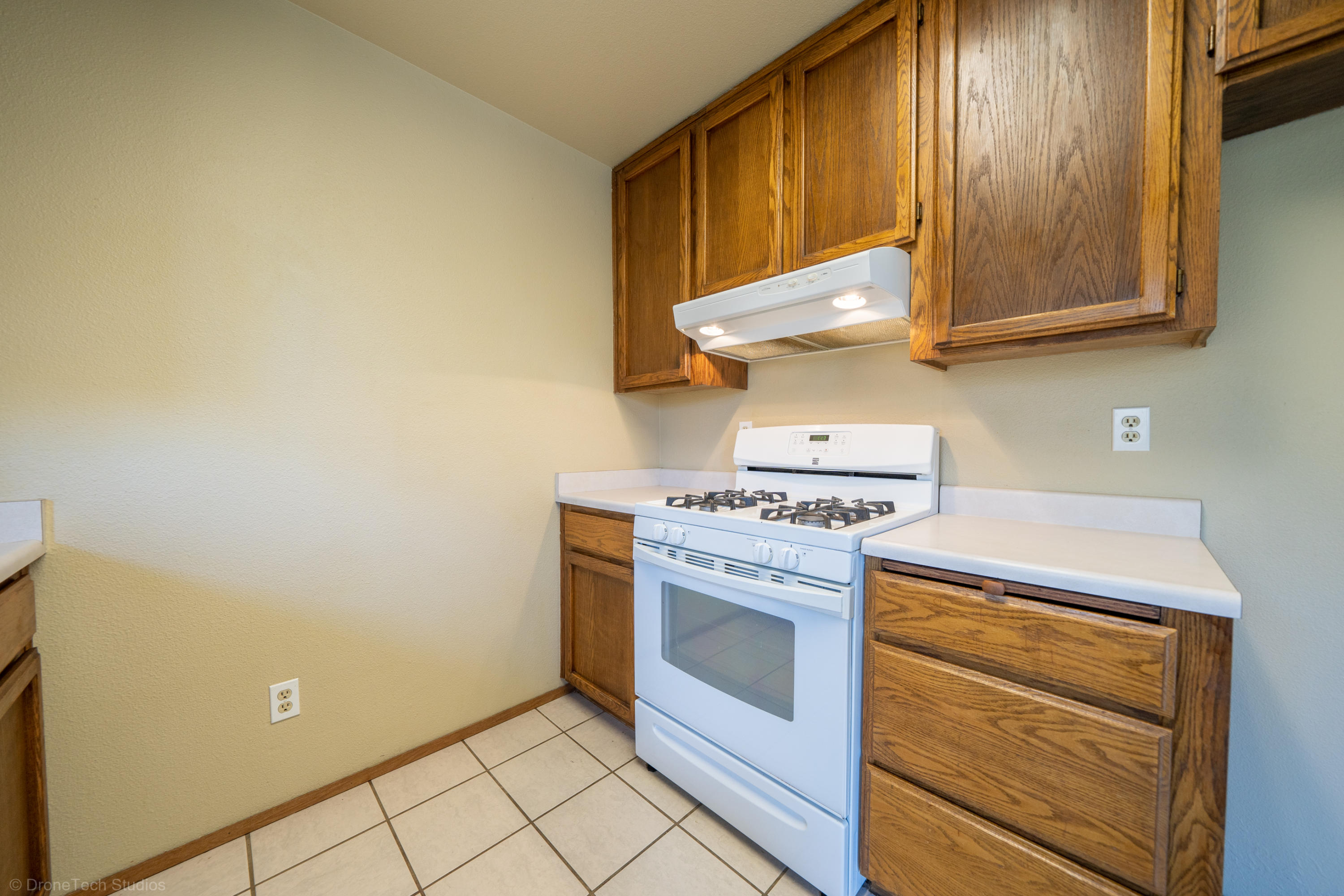 3645 Santa Rosa Way Redding, CA 96003 - Photo 16 of 48 a kitchen with a stove and a microwave