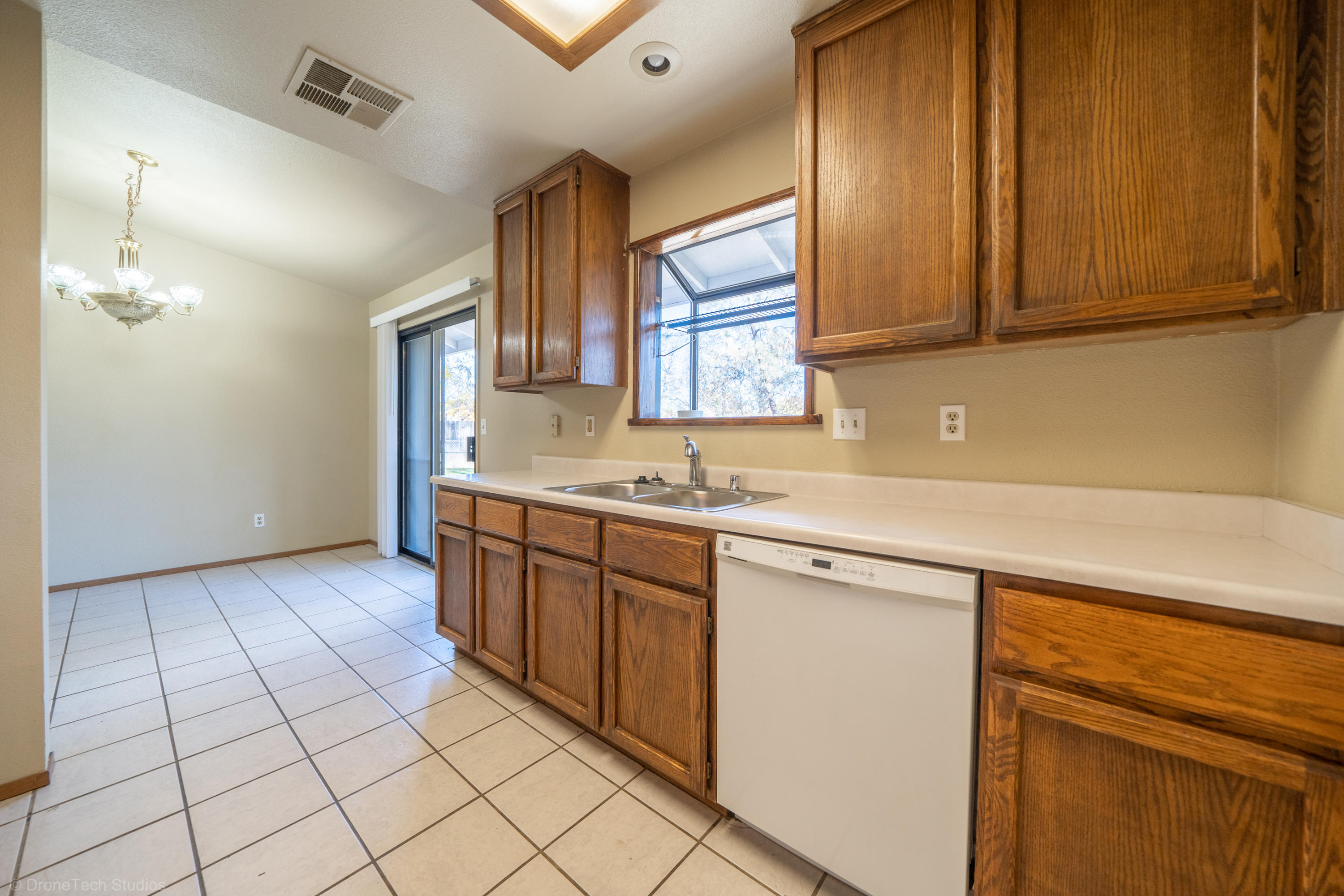 3645 Santa Rosa Way Redding, CA 96003 - Photo 17 of 48 a kitchen with stainless steel appliances granite countertop a sink and cabinets