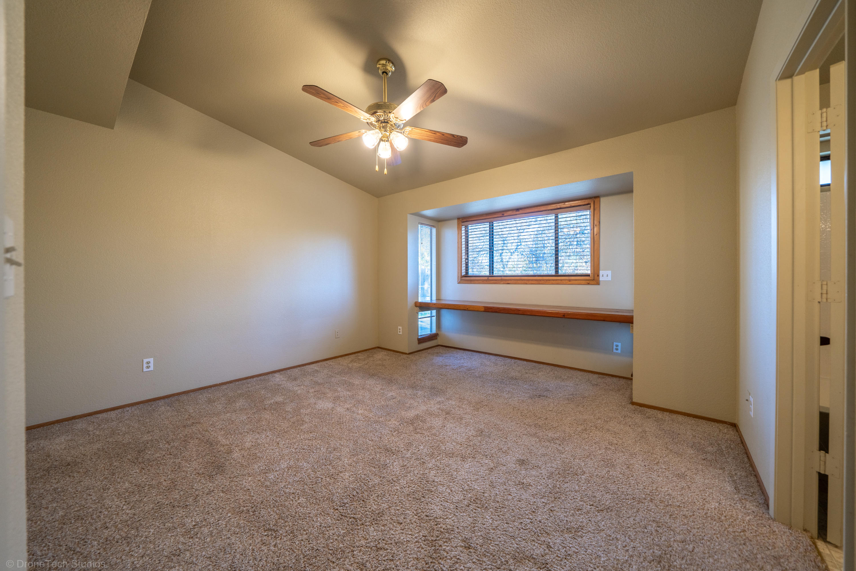 3645 Santa Rosa Way Redding, CA 96003 - Photo 18 of 48 a view of an empty room with a window