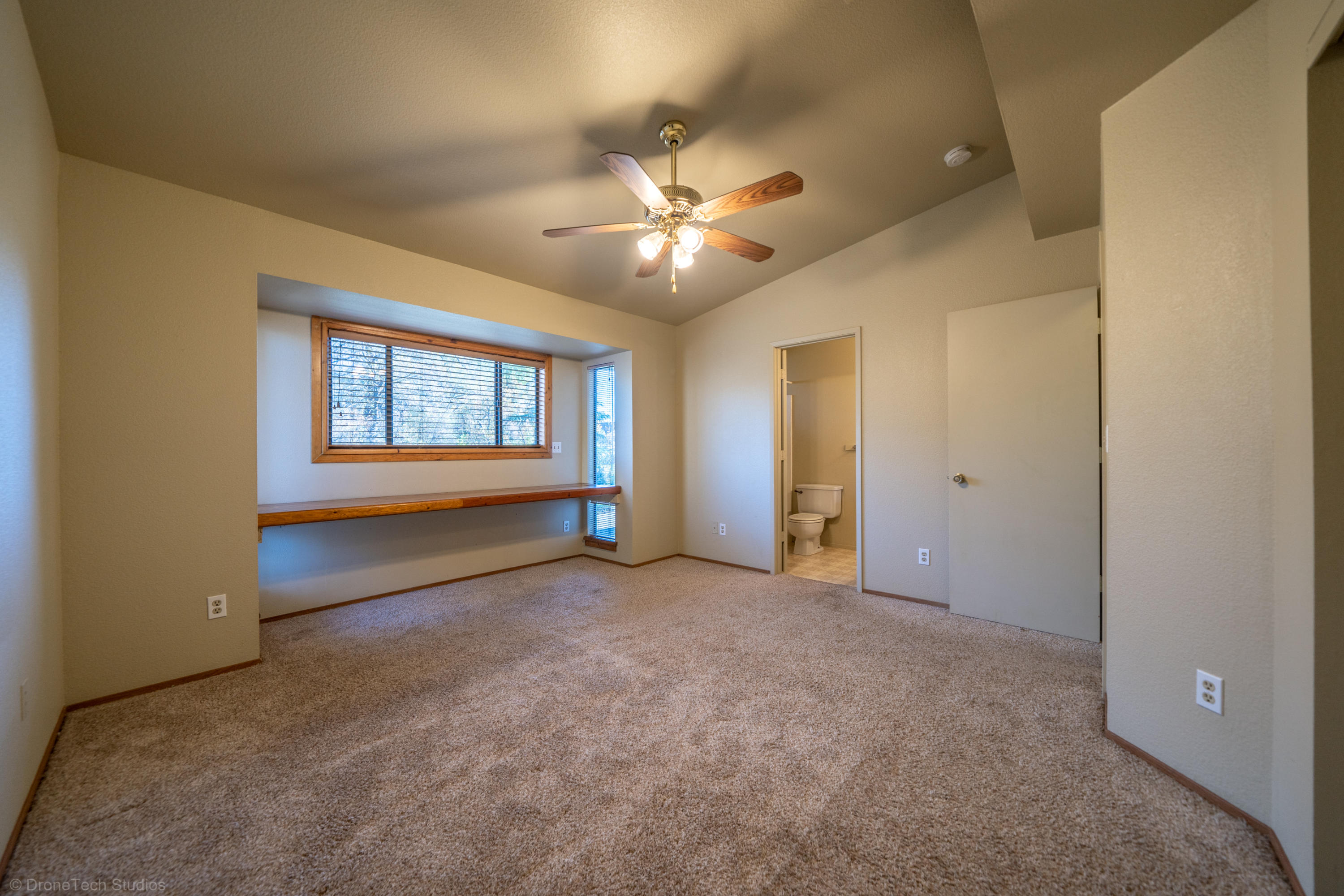 3645 Santa Rosa Way Redding, CA 96003 - Photo 20 of 48 an empty room with a window and a ceiling fan
