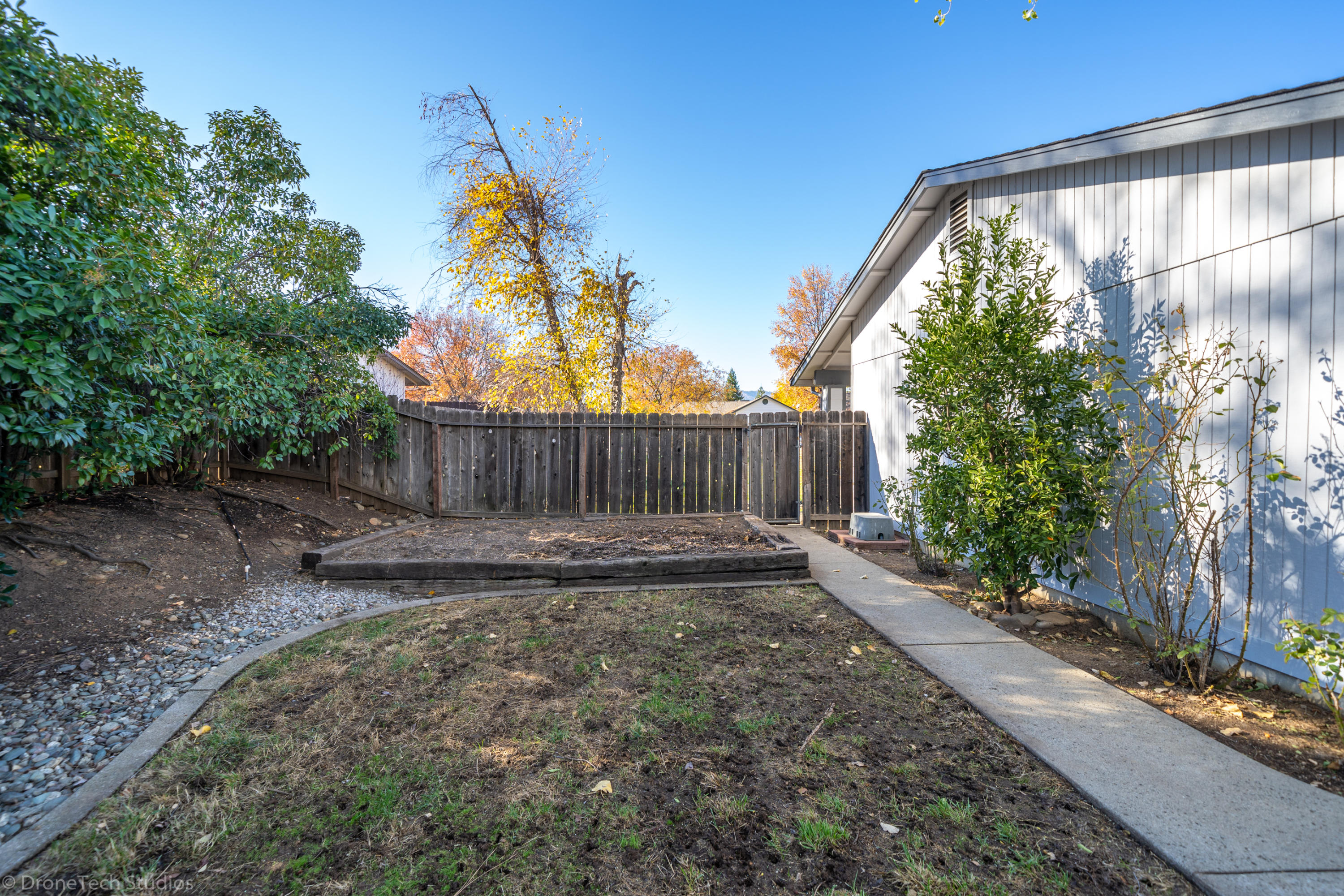 3645 Santa Rosa Way Redding, CA 96003 - Photo 36 of 48 a view of backyard with wooden fence
