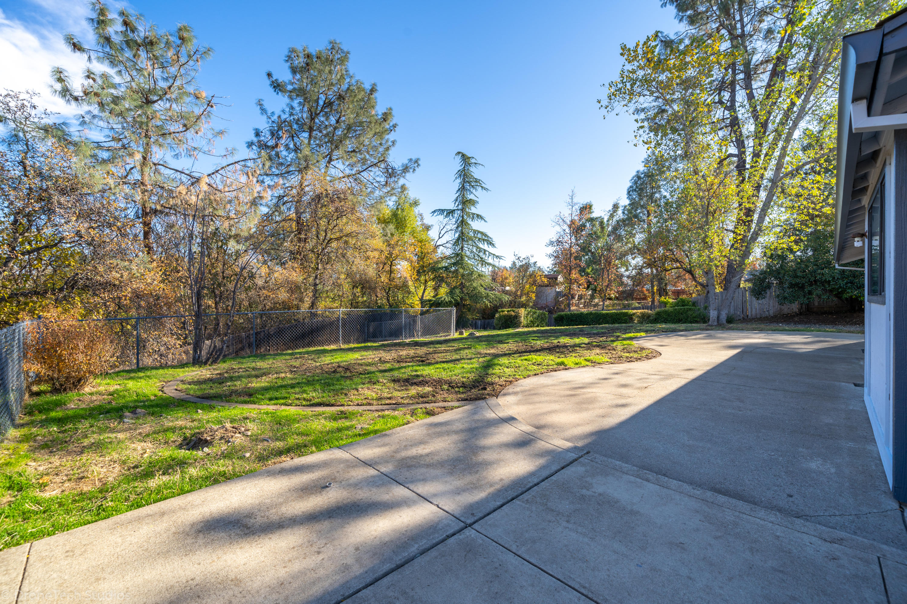 3645 Santa Rosa Way Redding, CA 96003 - Photo 38 of 48 a view of a swimming pool with a yard
