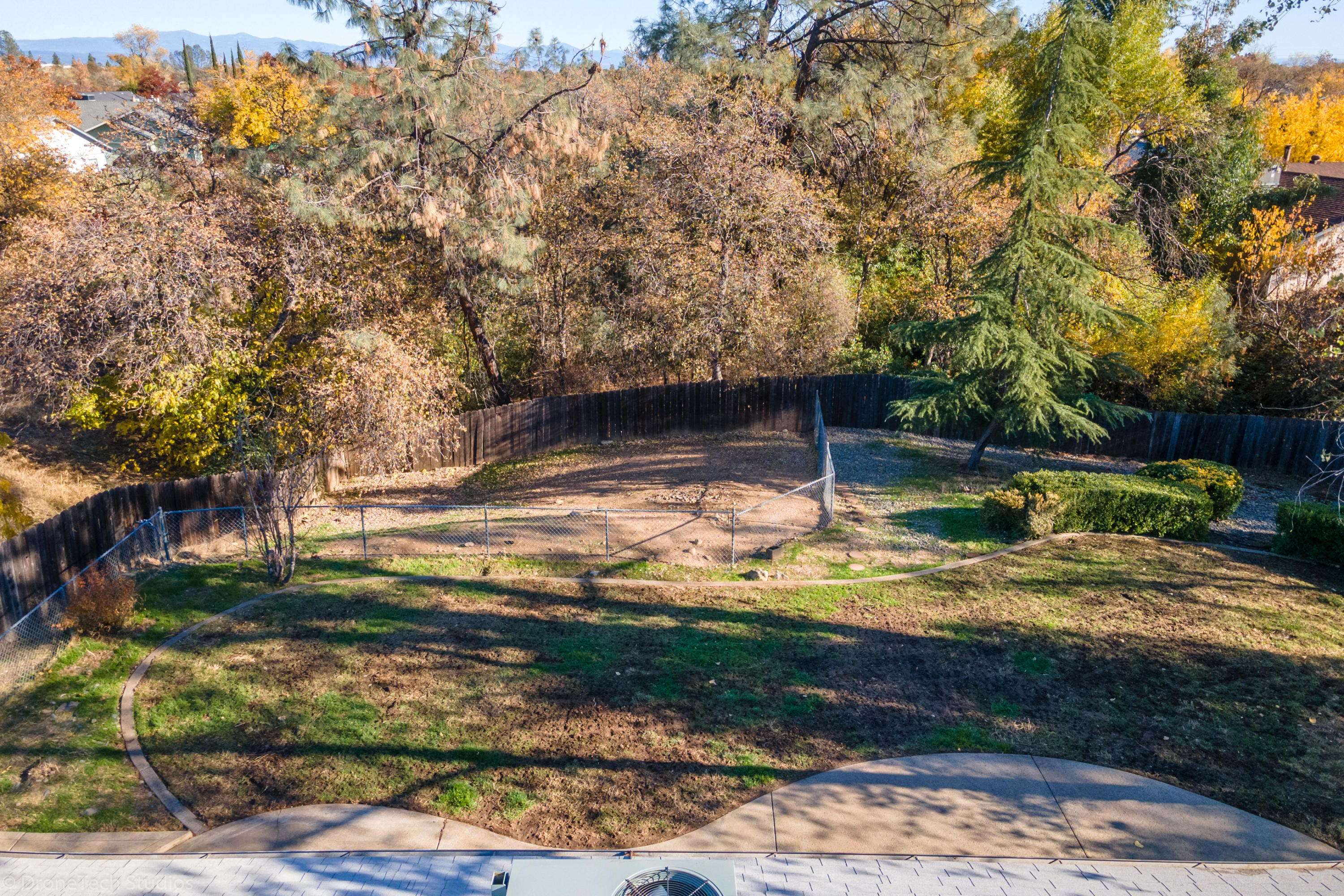 3645 Santa Rosa Way Redding, CA 96003 - Photo 47 of 48 a view of a yard with an tree