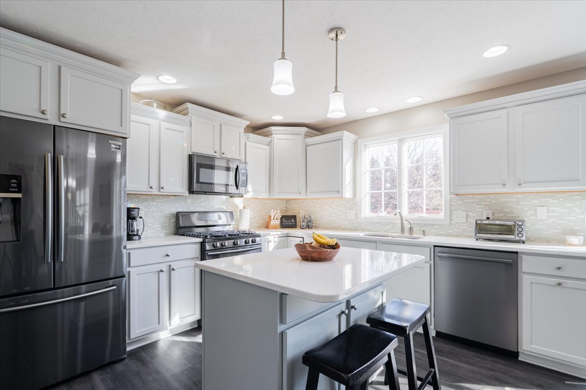 801 Balsam Road Normal, IL 61761 - Photo 14 of 56 a kitchen with a sink a center island stainless steel appliances and cabinets