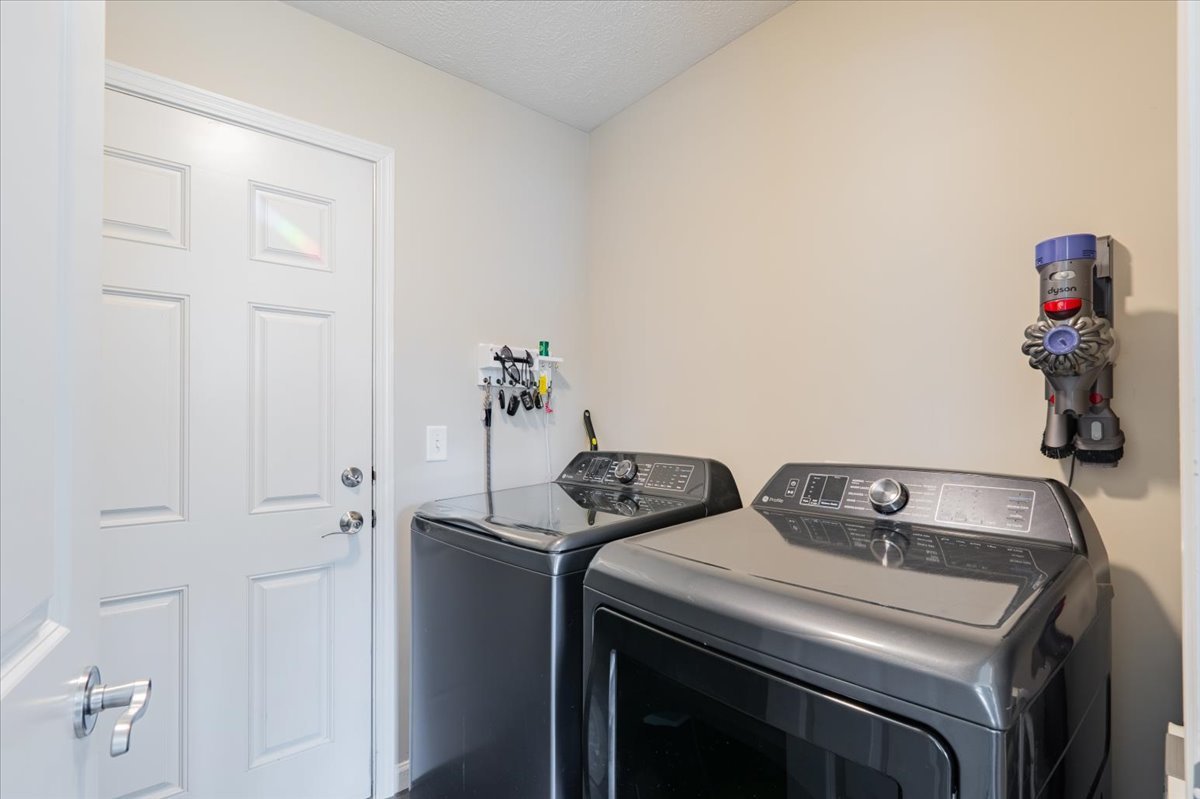 801 Balsam Road Normal, IL 61761 - Photo 18 of 56 a utility room with dryer and washer