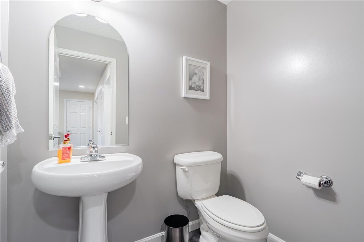 801 Balsam Road Normal, IL 61761 - Photo 19 of 56 a bathroom with a sink a toilet and mirror