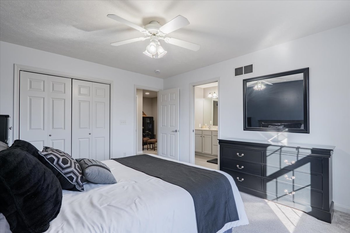 801 Balsam Road Normal, IL 61761 - Photo 31 of 56 a bedroom with a bed and a flat screen tv