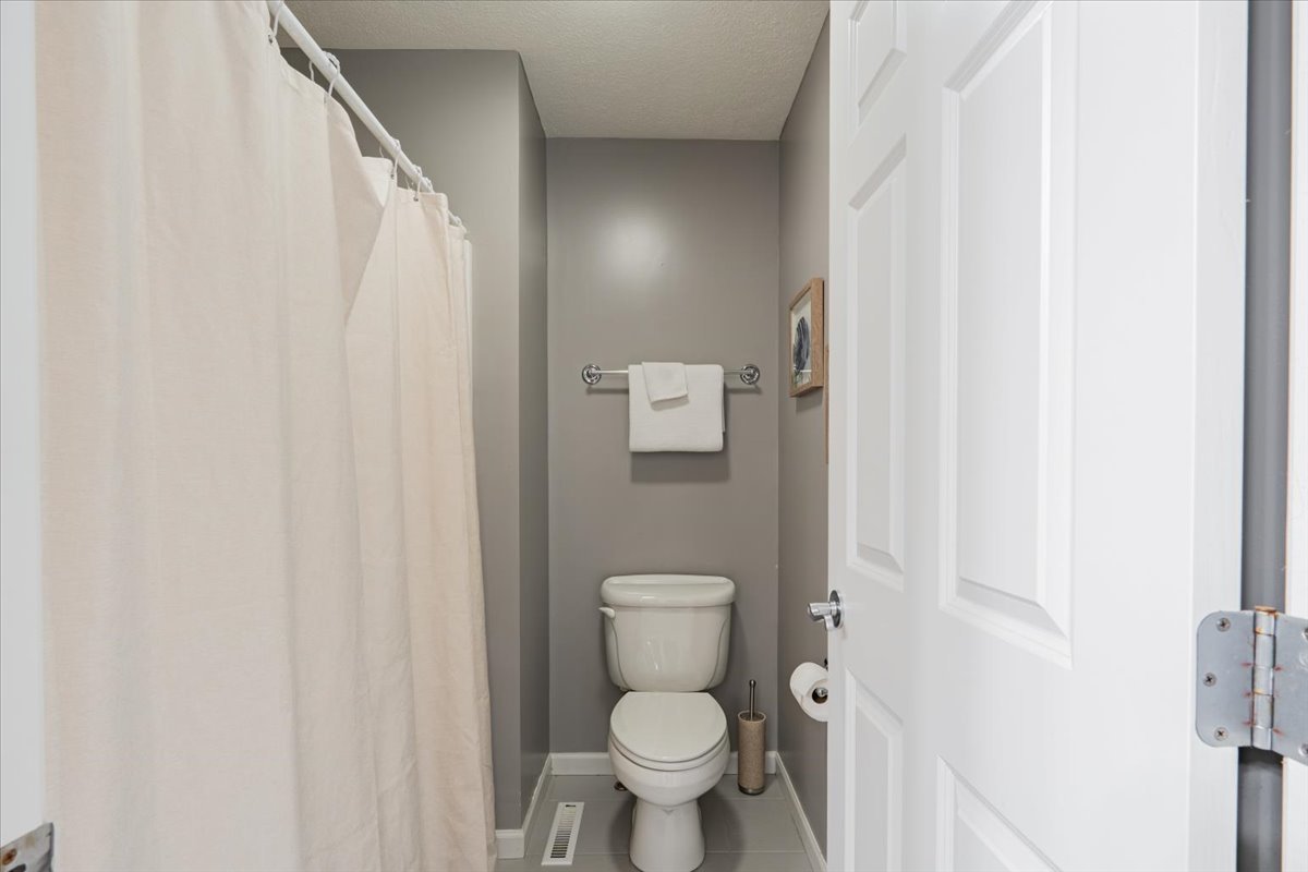 801 Balsam Road Normal, IL 61761 - Photo 33 of 56 a white toilet sitting next to a small bathroom