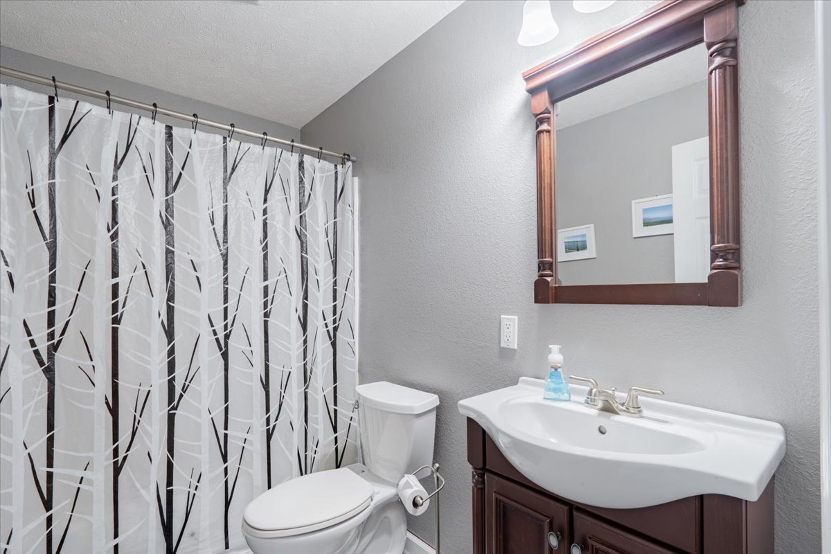 801 Balsam Road Normal, IL 61761 - Photo 38 of 56 a bathroom with a sink a toilet and a mirror