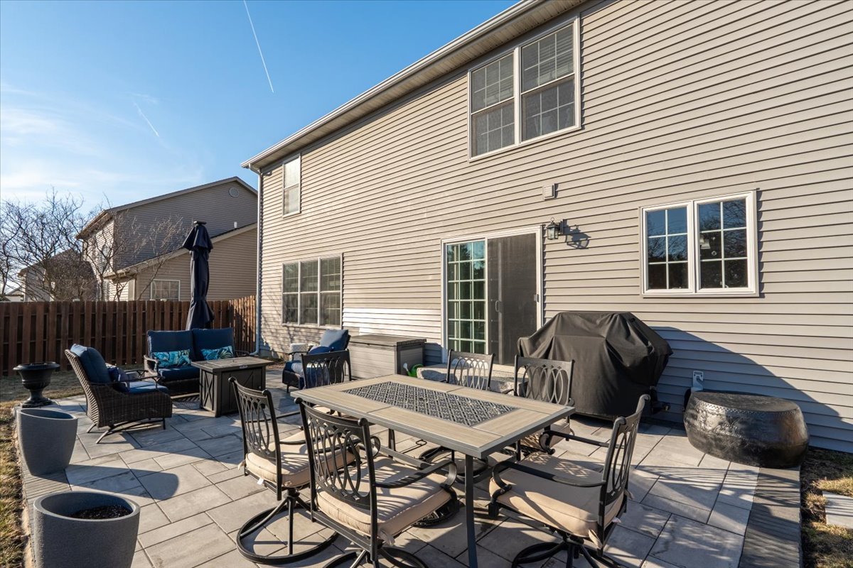 801 Balsam Road Normal, IL 61761 - Photo 45 of 56 a backyard of a house with table and chairs