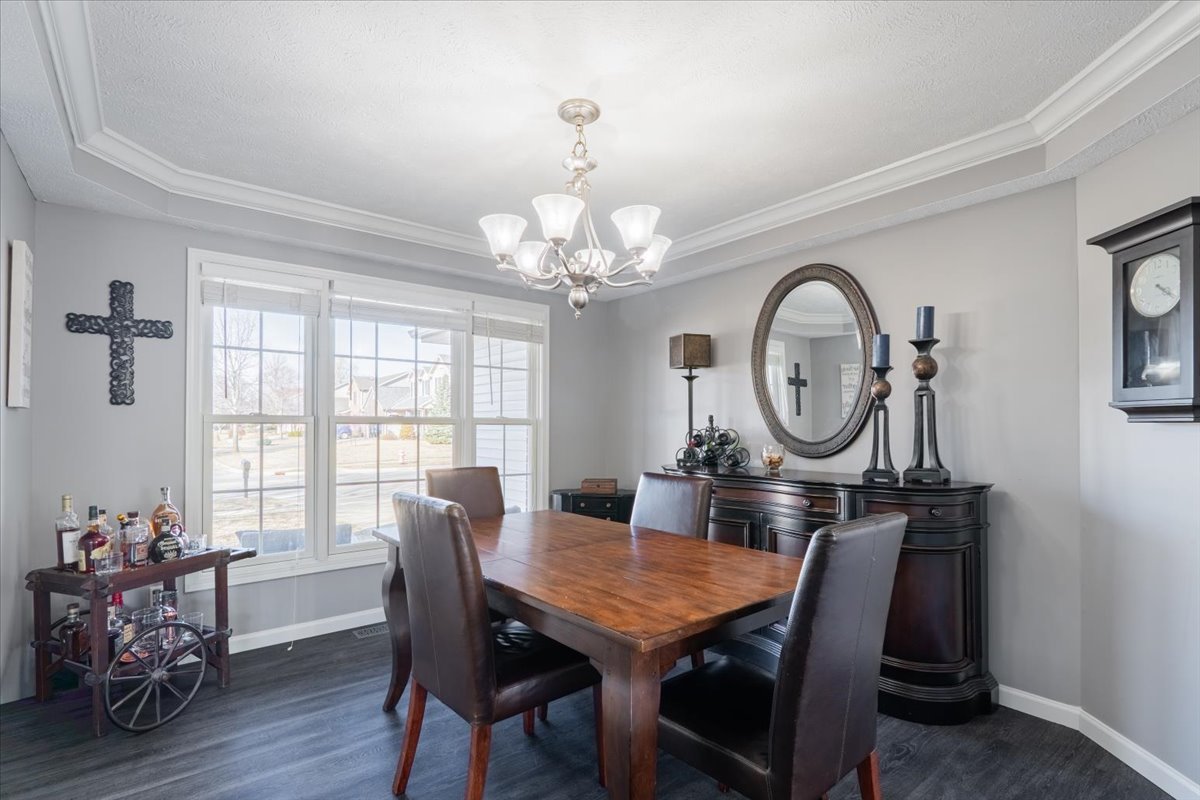 801 Balsam Road Normal, IL 61761 - Photo 5 of 56 a view of a dining room with furniture window and wooden floor