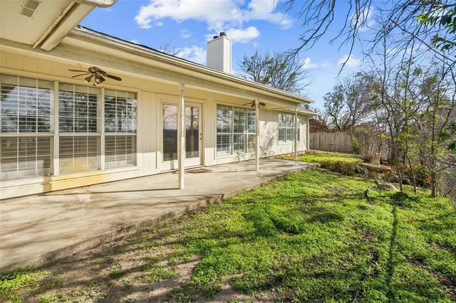 front view of a house with a large window