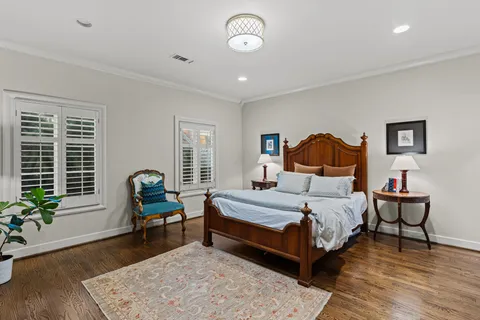 a spacious bathroom with a granite countertop sink mirror and bathtub
