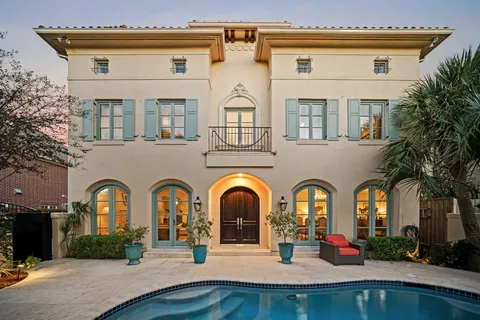 a living room with furniture potted plant and a fireplace