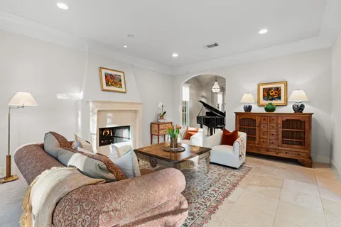 a view of a dining room with furniture and chandelier