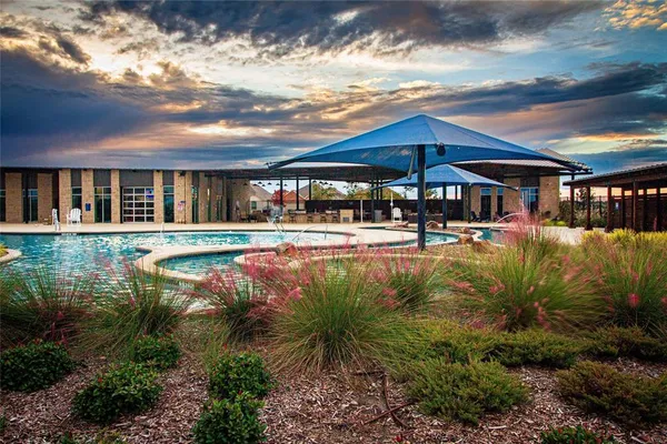 a view of a swimming pool with a patio