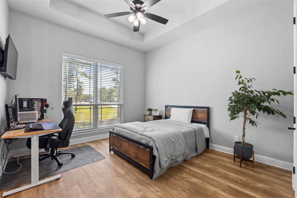 Tbd Tbd Anchor Point Quinlan, TX 75474 - Photo 24 of 40 a bedroom with a bed window and a flat screen tv