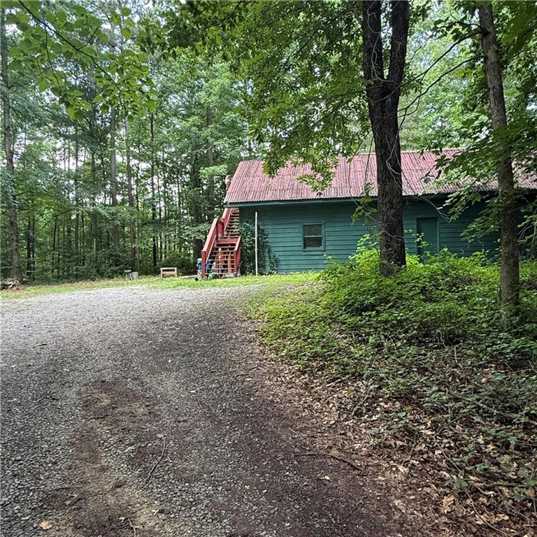 1862 Forrest Road Lawrenceville, GA 30043 - Photo 13 of 17 a view of a house with a tree and yard