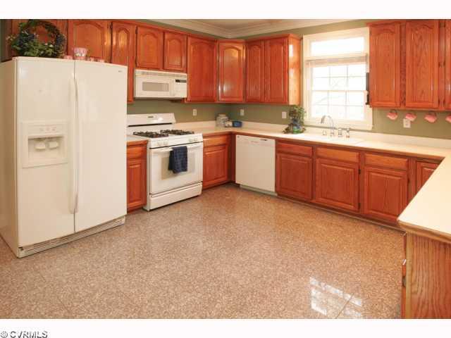 9720 Coalboro Road Chesterfield, VA 23838 - Photo 2 of 12 Kitchen - Granite flooring! WOW! Crown and chair molding! Desk (not shown)! New dishwasher!