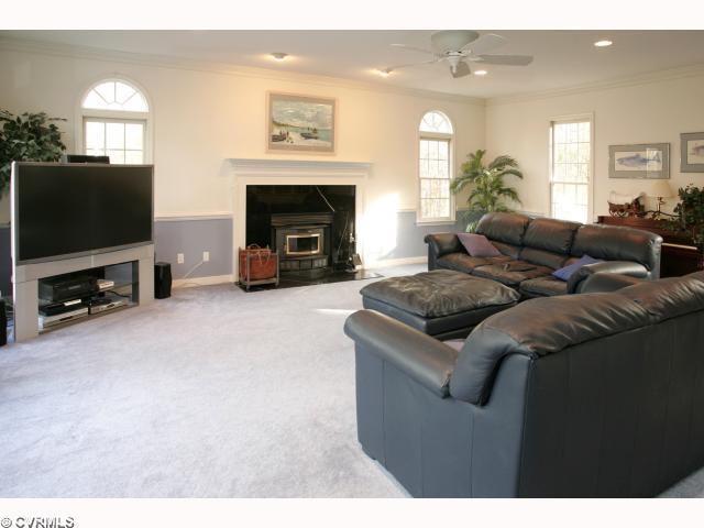 9720 Coalboro Road Chesterfield, VA 23838 - Photo 3 of 12 Den/Family/Great Room - HUGE!! Chair & crown moldings! Recessed lighting! Marble surround on woodburning fireplace which also has a catalytic converter for whole house heating! Built-ins (not picured) are also a great part of this room!