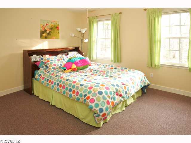 9720 Coalboro Road Chesterfield, VA 23838 - Photo 9 of 12 Bedroom - Bedroom has wall-to-wall carpet with ceiling fan!