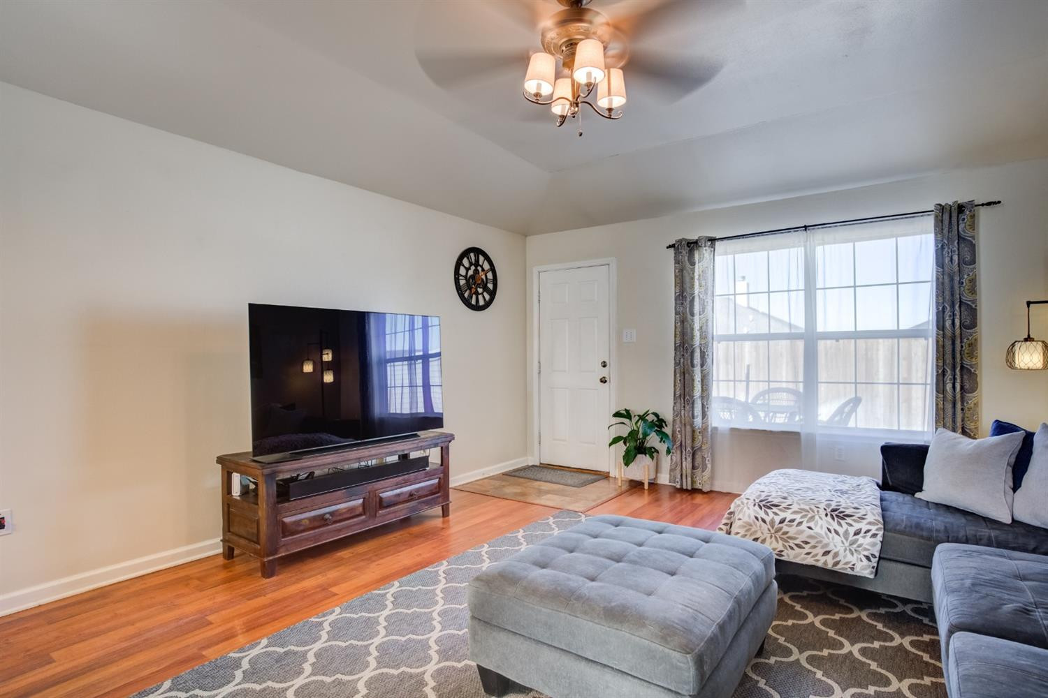 6514 86th Street Lubbock, TX 79424 - Photo 12 of 34 a living room with furniture and a flat screen tv